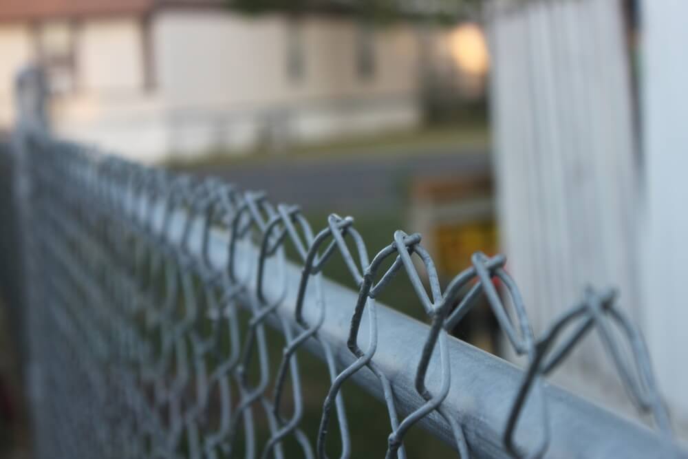 Install a chain link fence